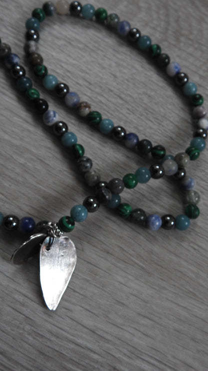 Final glamour shot of sterling silver hybrid pendant showcasing complete land-and-sea inspired design from Northern Ireland coastal experiences.