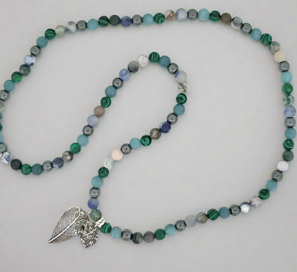 Final glamour shot of sterling silver hybrid pendant showcasing complete land-and-sea inspired design.