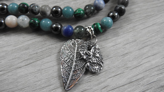 Handcrafted sterling silver hybrid pendant combining leaf and coral textures inspired by Northern Ireland coastlines, front view against white background.