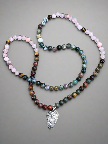 Artistic styling shot of rustic leaf necklace highlighting handcrafted nature-inspired sterling silver design.