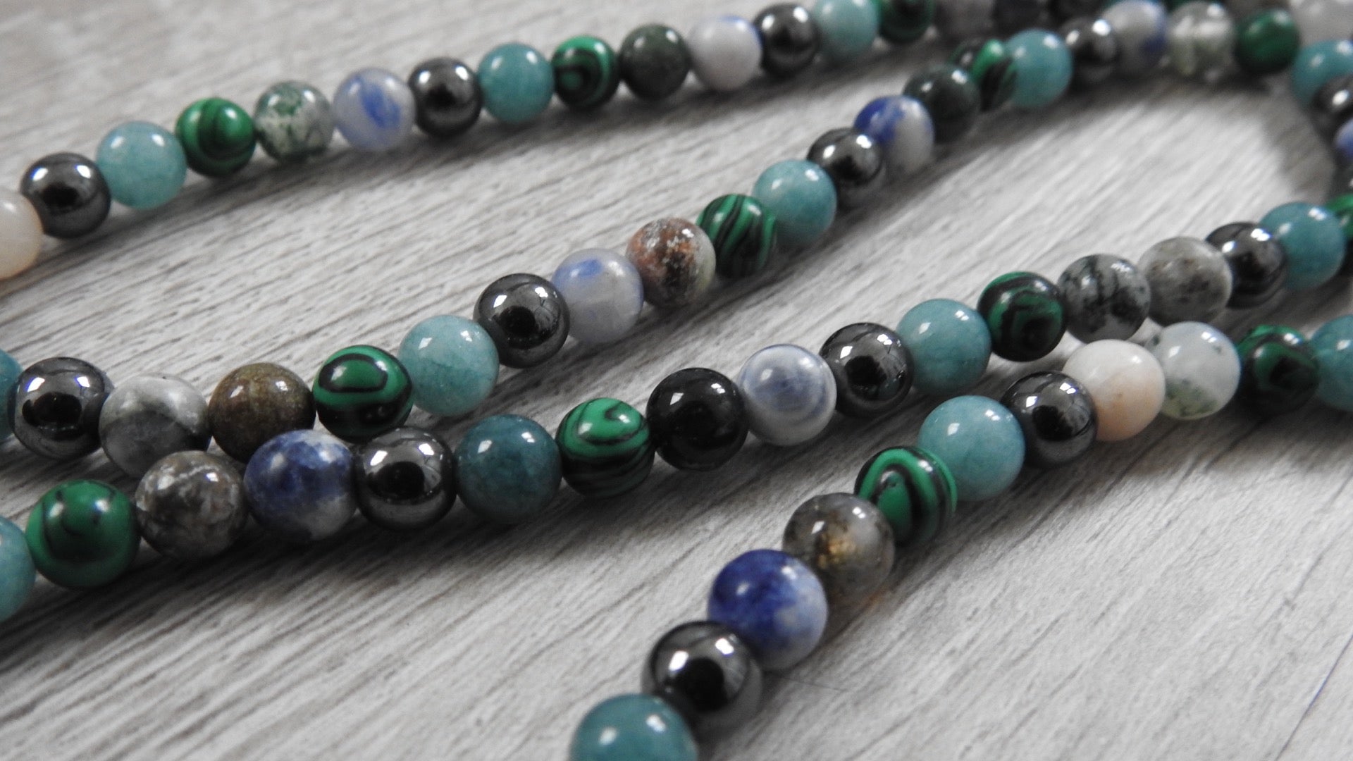 Close-up detail of sterling silver hybrid pendant showing intricate leaf and coral texture fusion with antique silver finish.